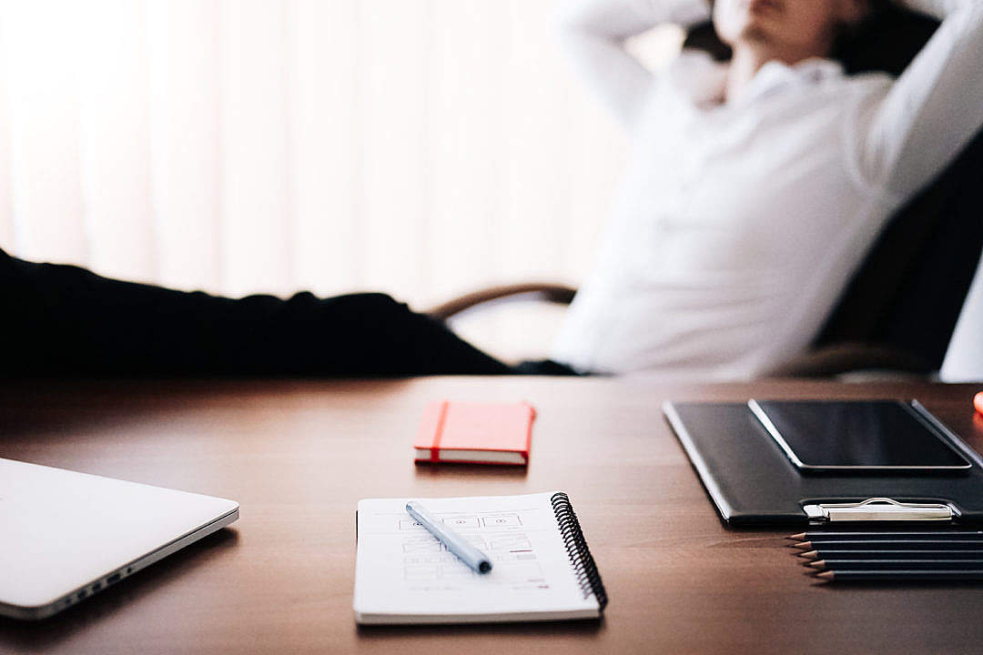 Man Relaxing in Office With Legs Up: All Work Done