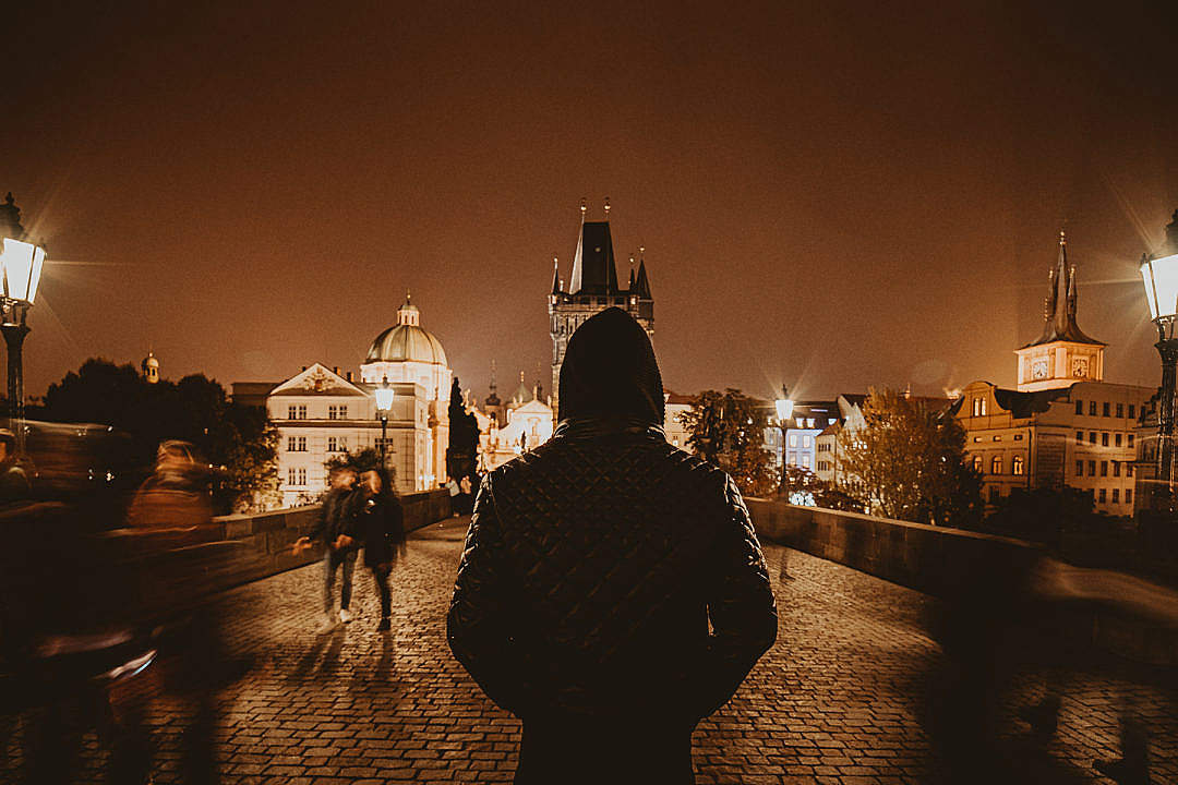Man Standing on Charles Bridge in Prague