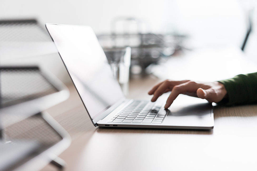 Man Using His Laptop in the Office