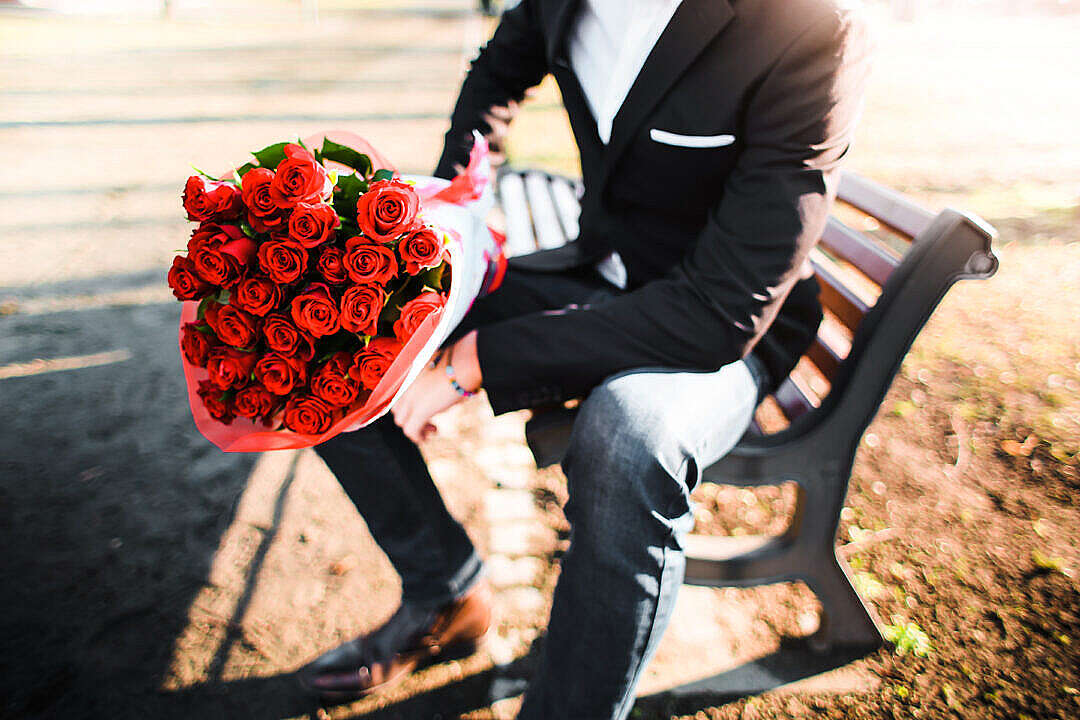 Download Man with a Bouquet of Roses FREE Stock Photo