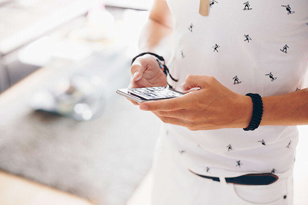 Man Working on iPhone while Walking