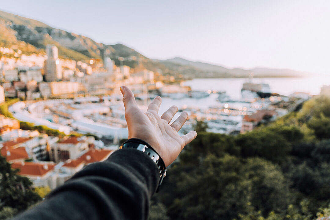 Download Man’s Hand Showing The City of Monaco FREE Stock Photo