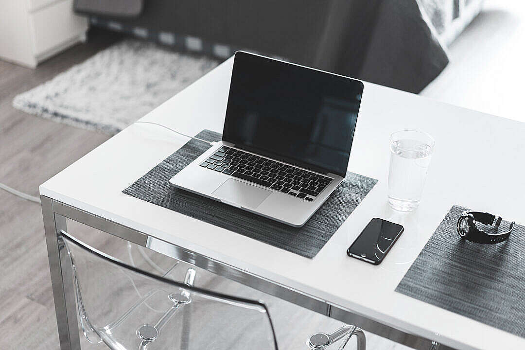 Download Minimalistic White Desk Home Office Laptop and Smartphone FREE Stock Photo