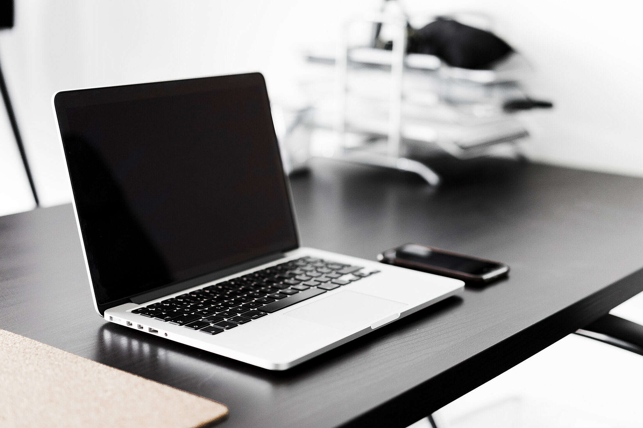 Modern Laptop and Smartphone on Black Desk Free Stock Photo