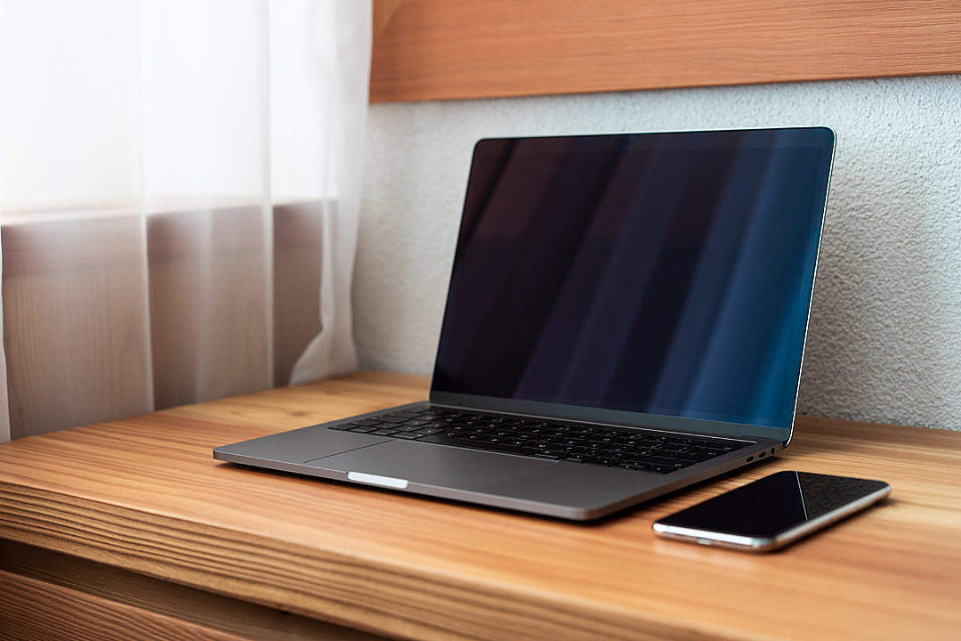 Download Modern Laptop on Wooden Desk FREE Stock Photo