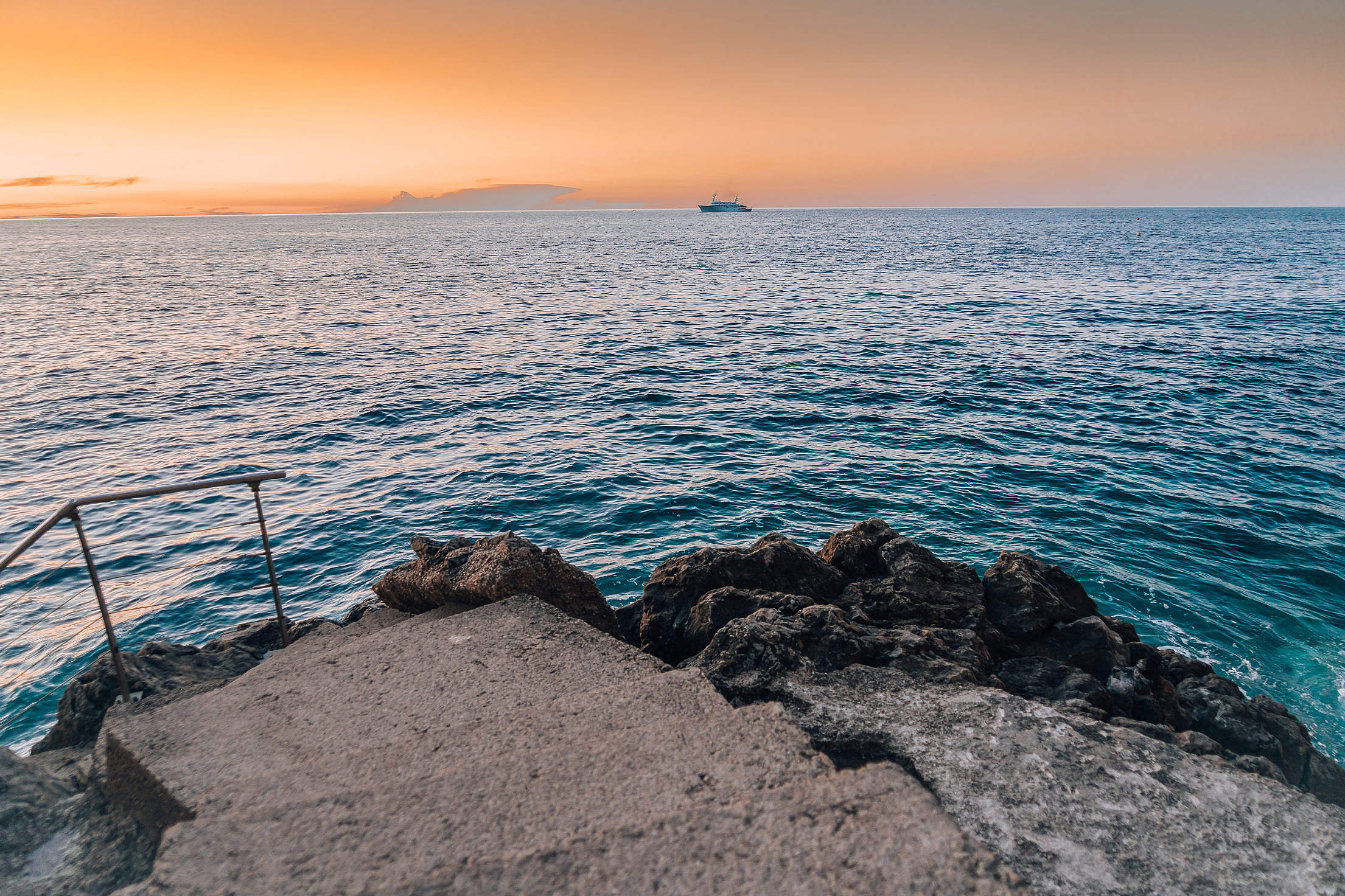 Morning Sea Horizon with a Boat Free Stock Photo