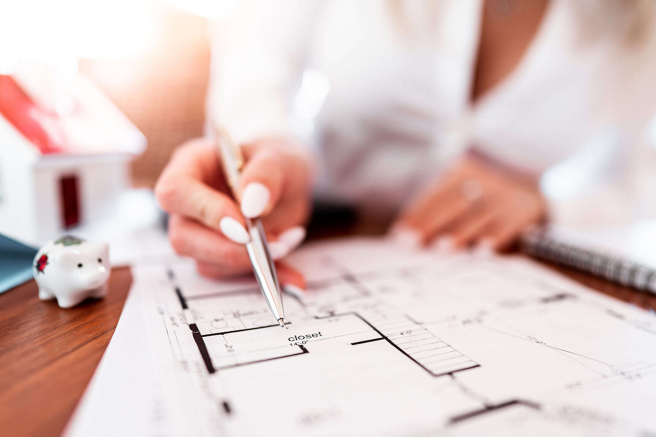 Office Worker Explaining Ground Plan of a House Construction Free Stock Photo