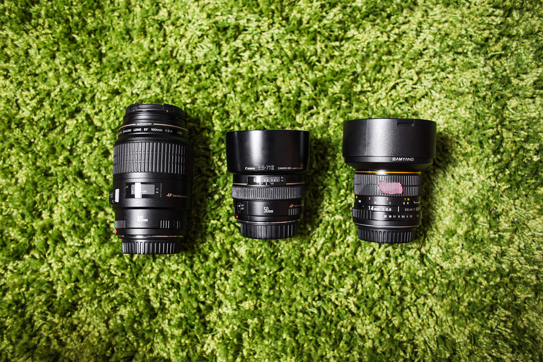 Photography Camera DSLR Lenses on Green Carpet Free Stock Photo