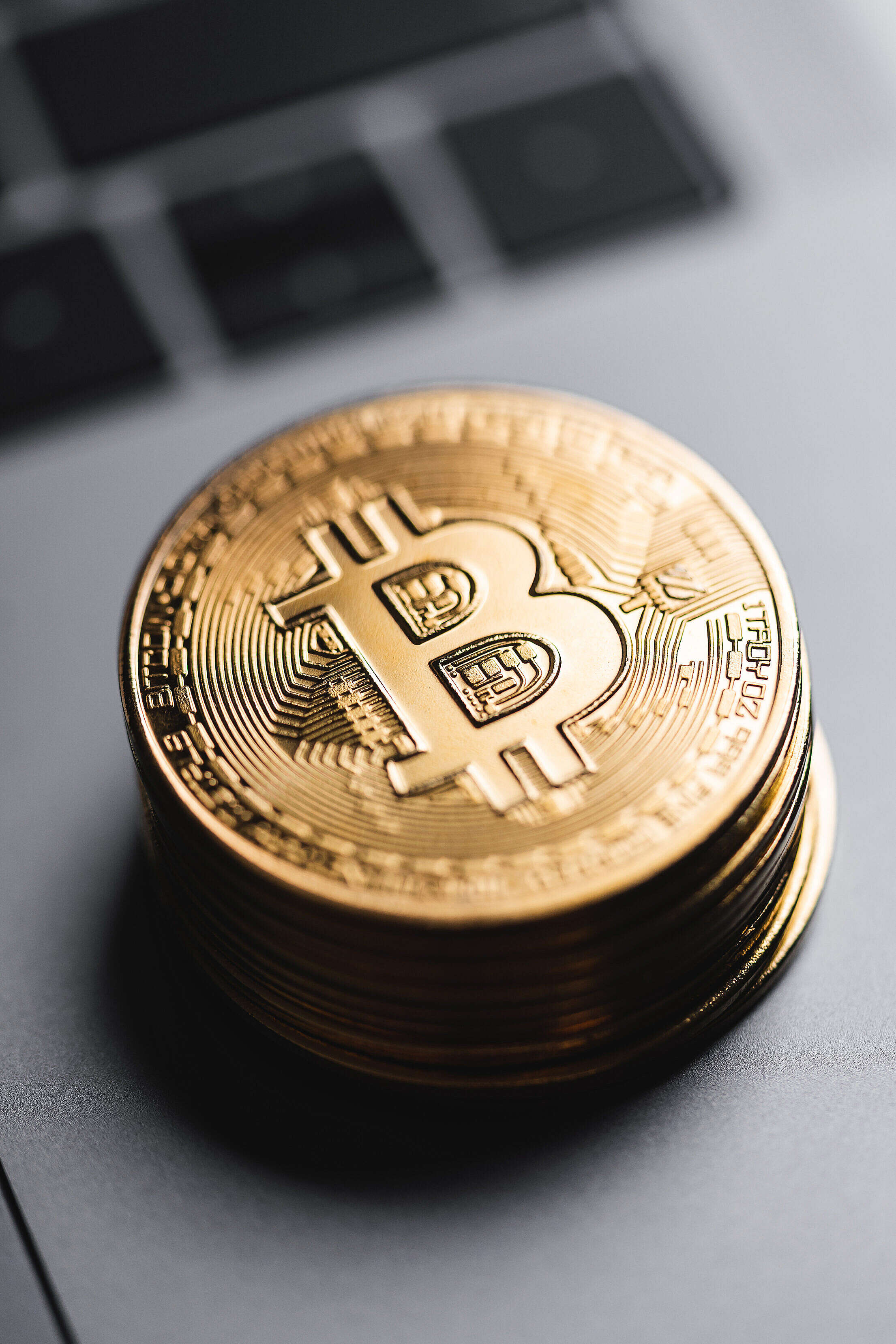 Pile of Bitcoins Lying on The Laptop Close Up Free Stock Photo