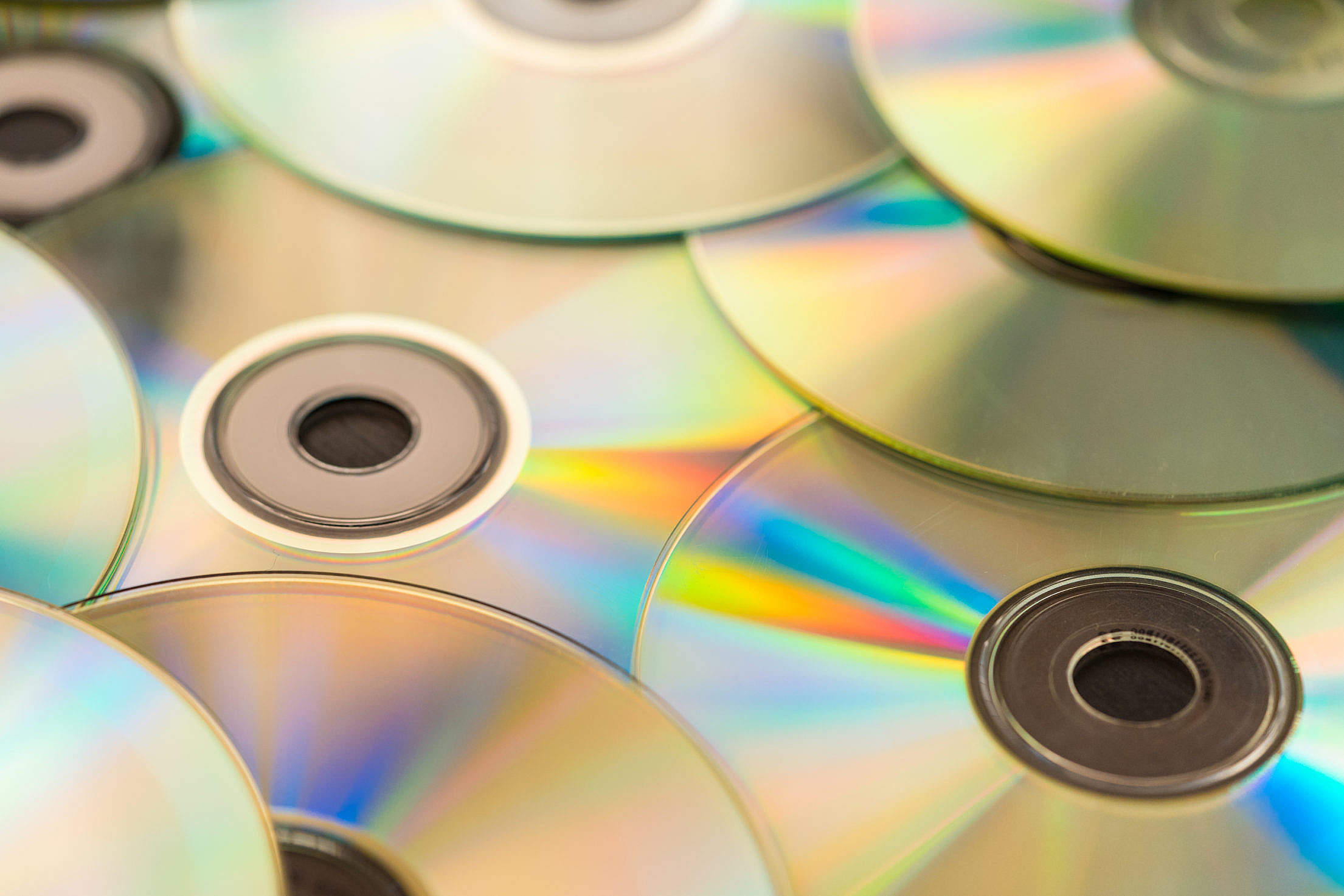 Pile of CD Compact Discs and DVDs Free Stock Photo
