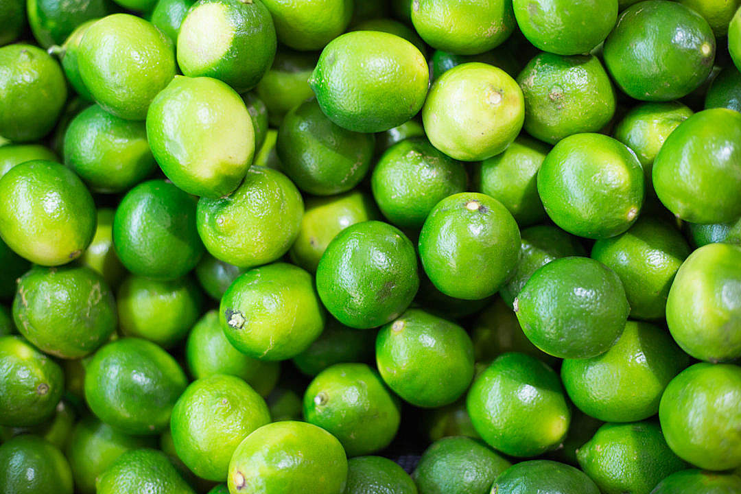 Download Pile of Green Limes on Market Pattern FREE Stock Photo