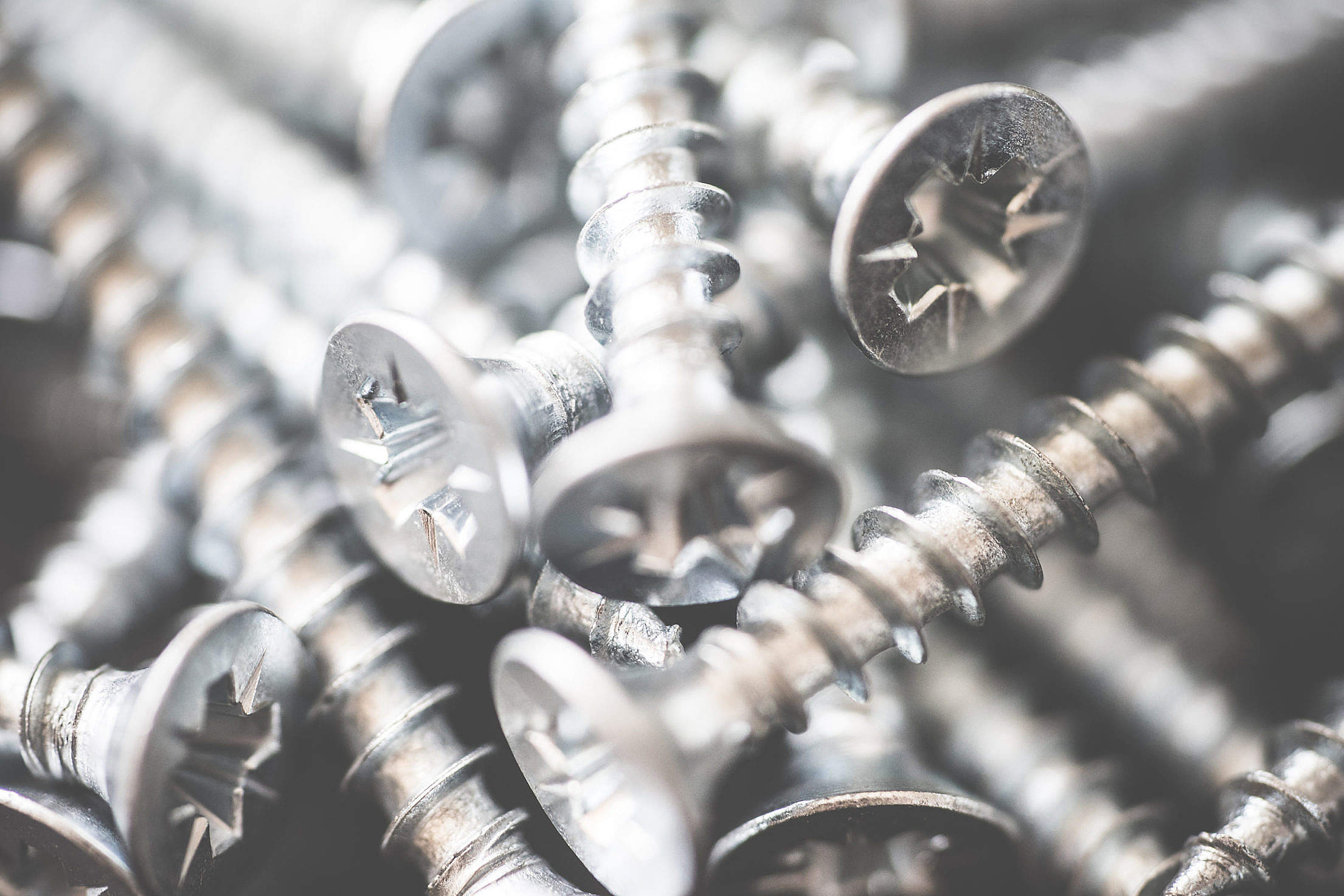 Pile of Silver Flat Crosshead Screws Close Up #2 Free Stock Photo