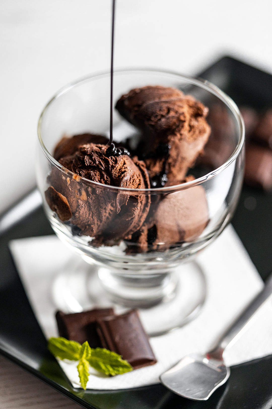 Download Pouring Chocolate Topping on The Ice-cream Sundae FREE Stock Photo