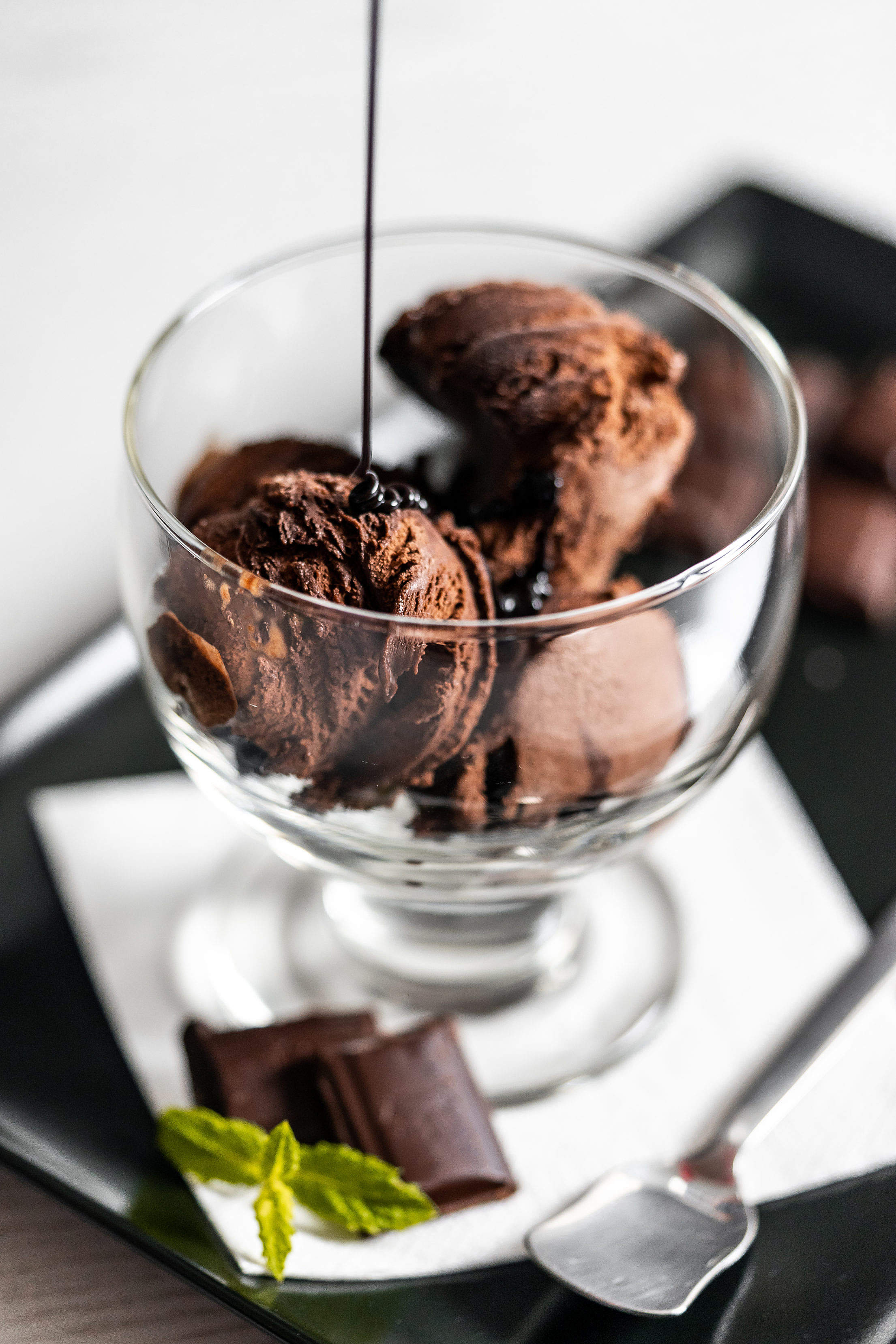 Pouring Chocolate Topping on The Ice-cream Sundae Free Stock Photo