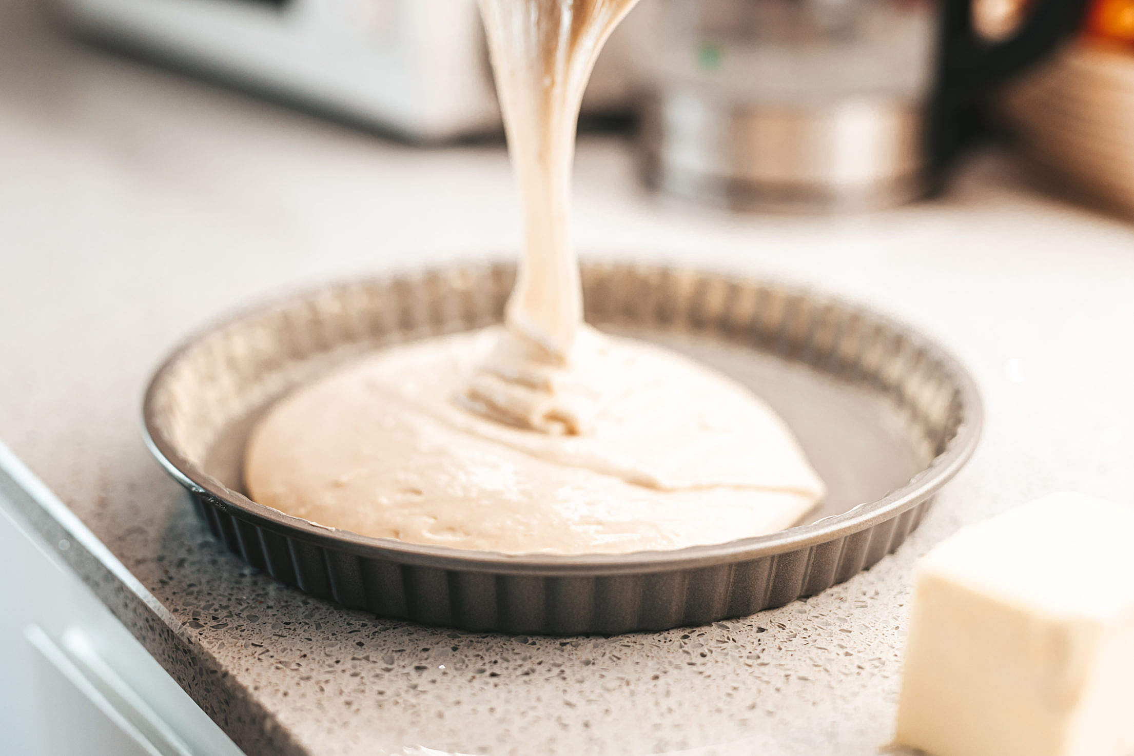 Pouring Dough into a Baking Pan Free Stock Photo