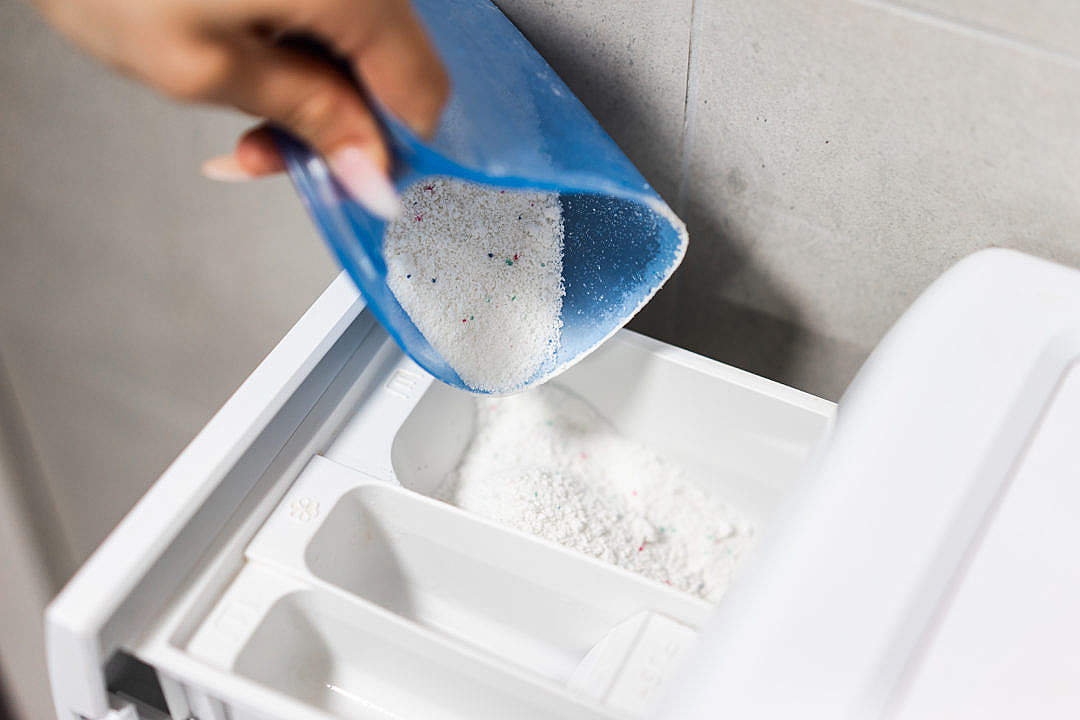 Download Pouring Washing Powder into The Washing Machine FREE Stock Photo
