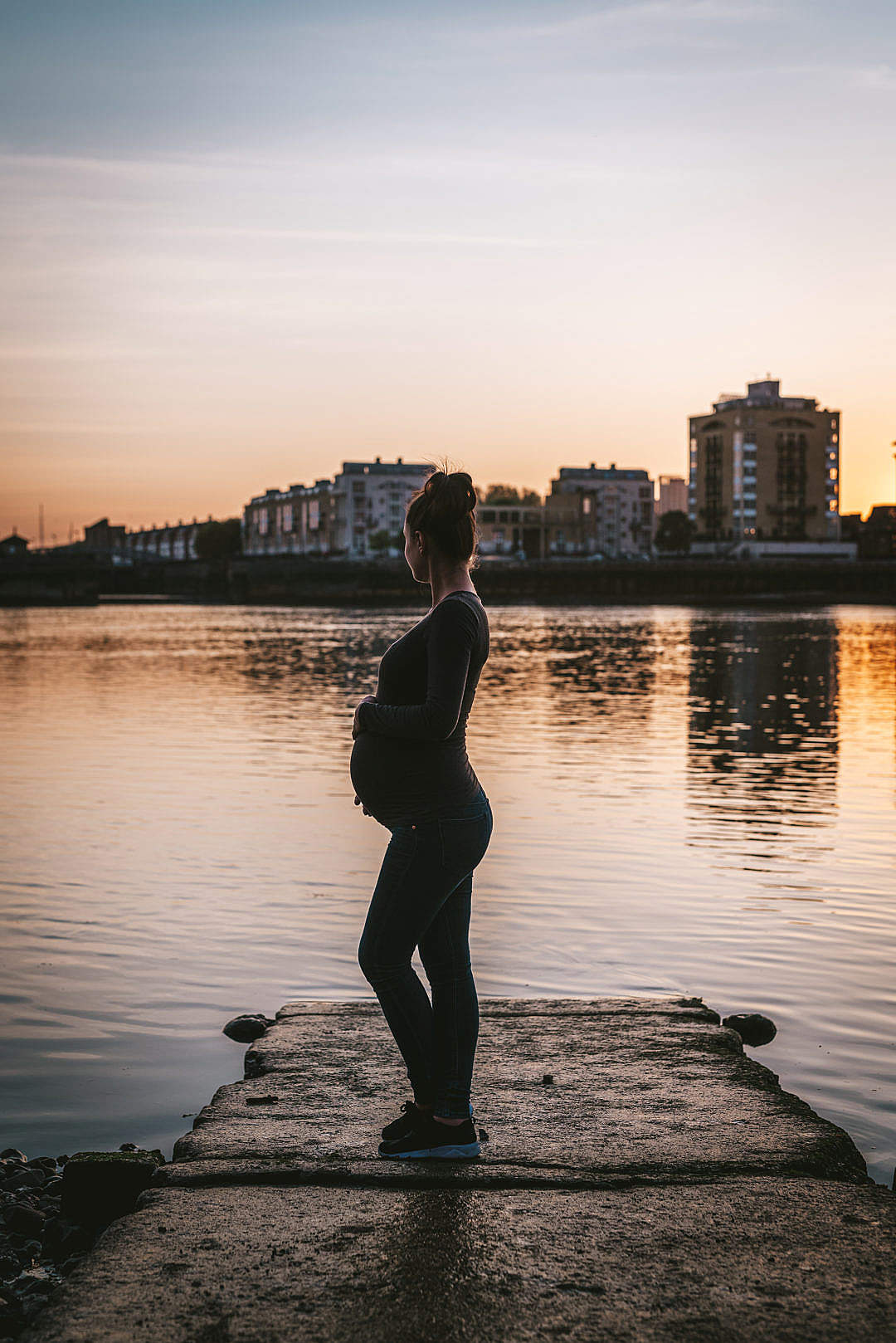 Download Pregnant Woman Enjoying Sunset by the River FREE Stock Photo