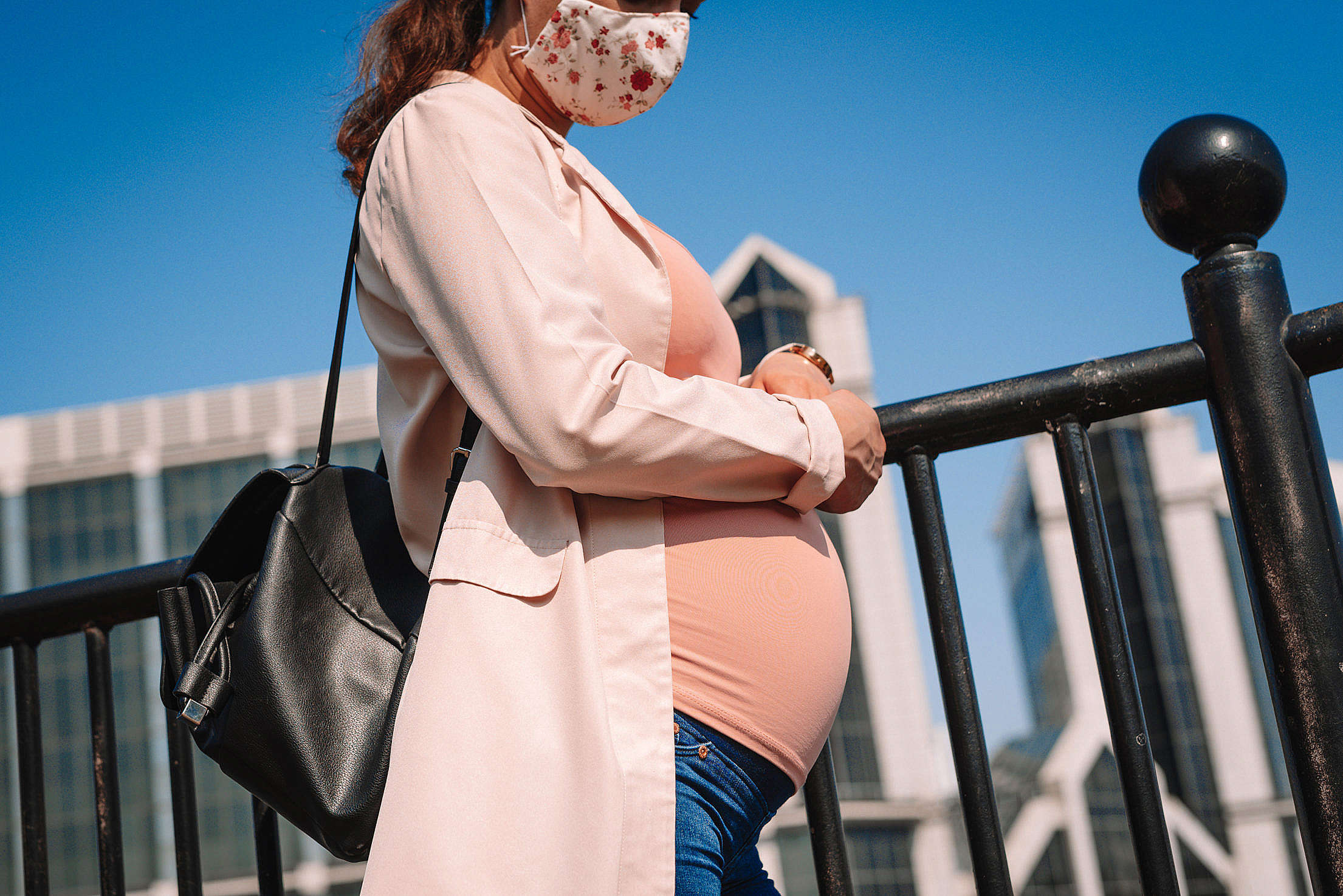 Pregnant Woman Wearing a Face Mask on a Street Free Stock Photo