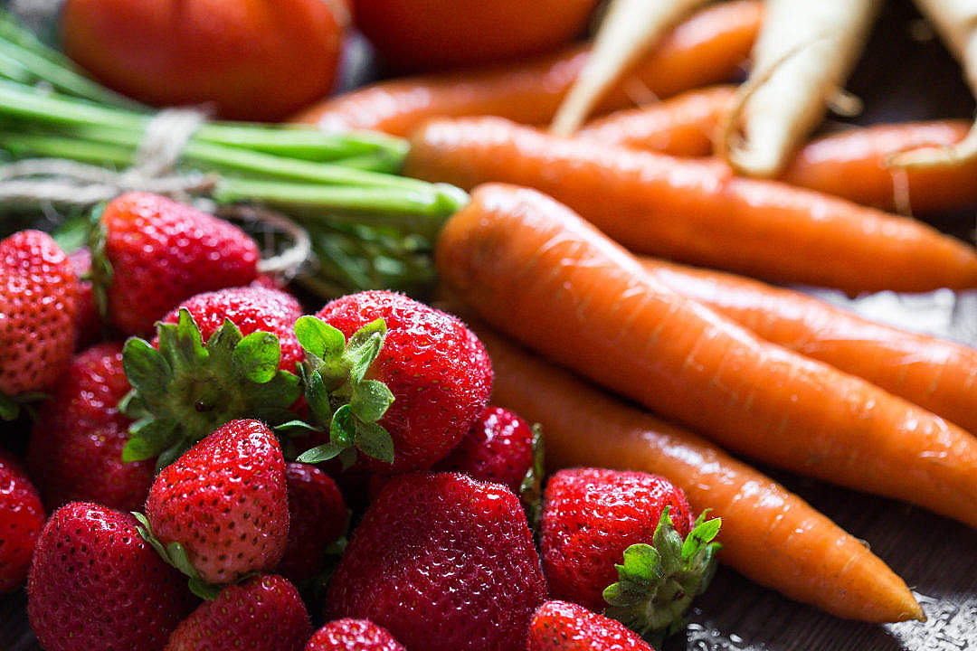 Download Preparing Fresh Breakfast: Strawberries & Carrots FREE Stock Photo