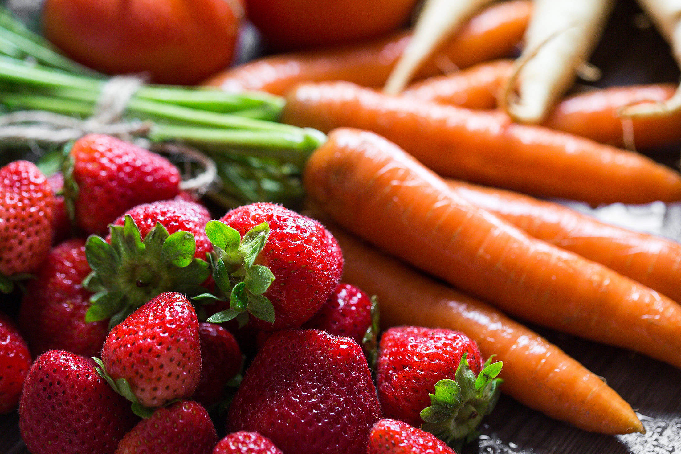 Preparing Fresh Breakfast Strawberries & Carrots Free Stock Photo