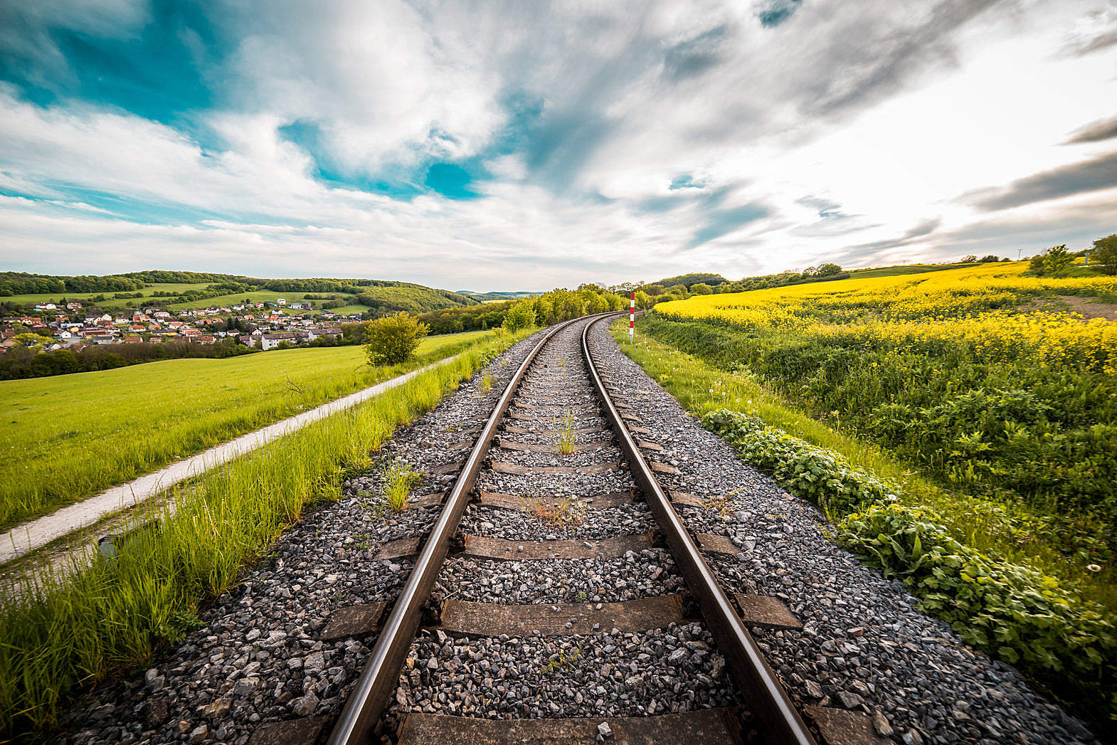 railway-road-in-the-middle-of-a-field-2-free-stock-photo-picjumbo