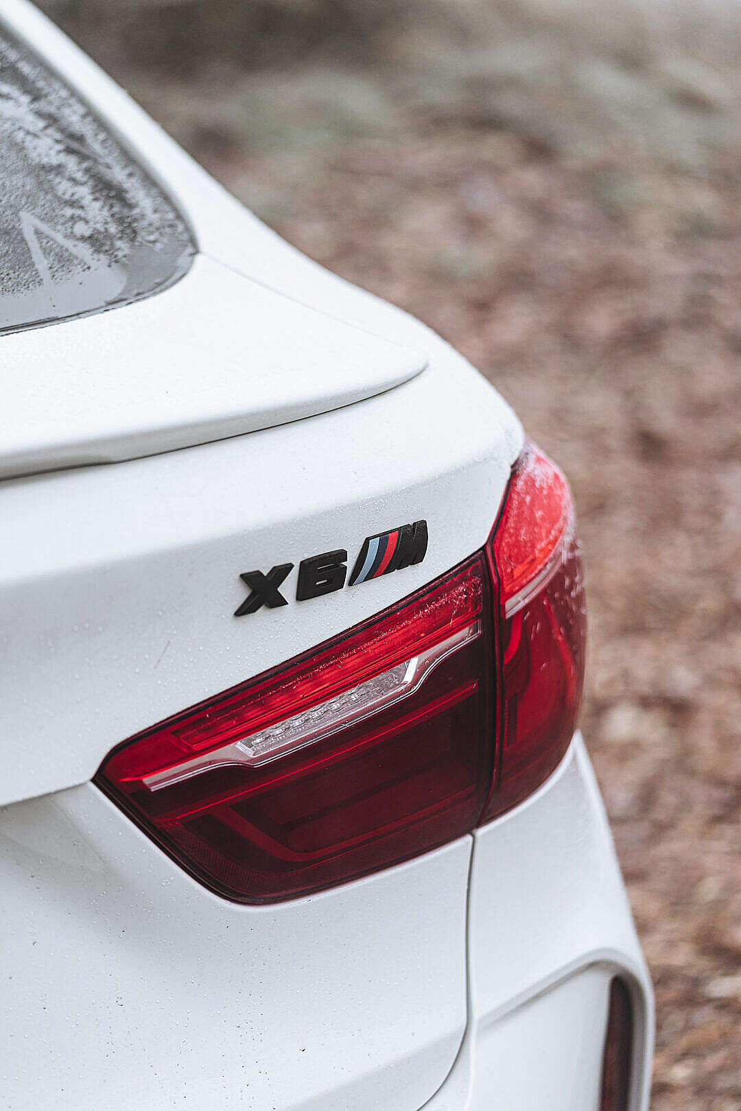 Rear Black Logo Badge BMW X6M in Winter