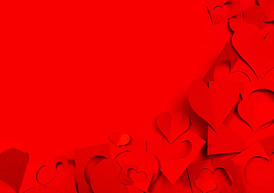Red Background with Paper Hearts and Copy Space