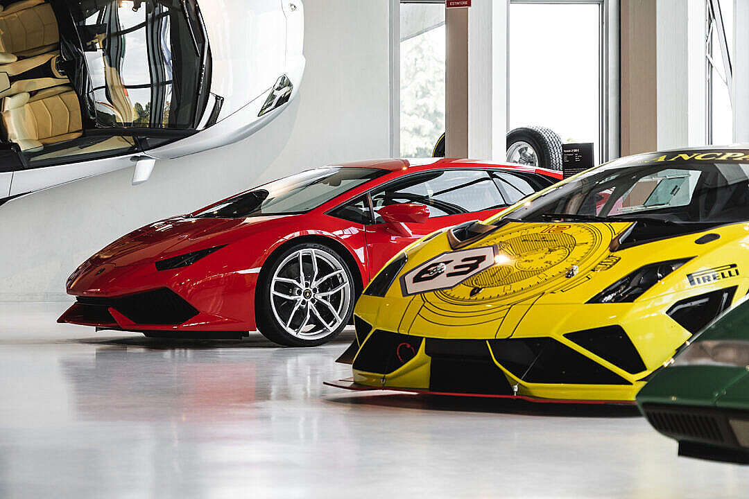Download Red Huracán and Yellow Racing Gallardo in Lamborghini Museum FREE Stock Photo