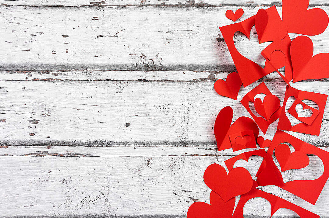 Red Paper Hearts on White Wooden Background