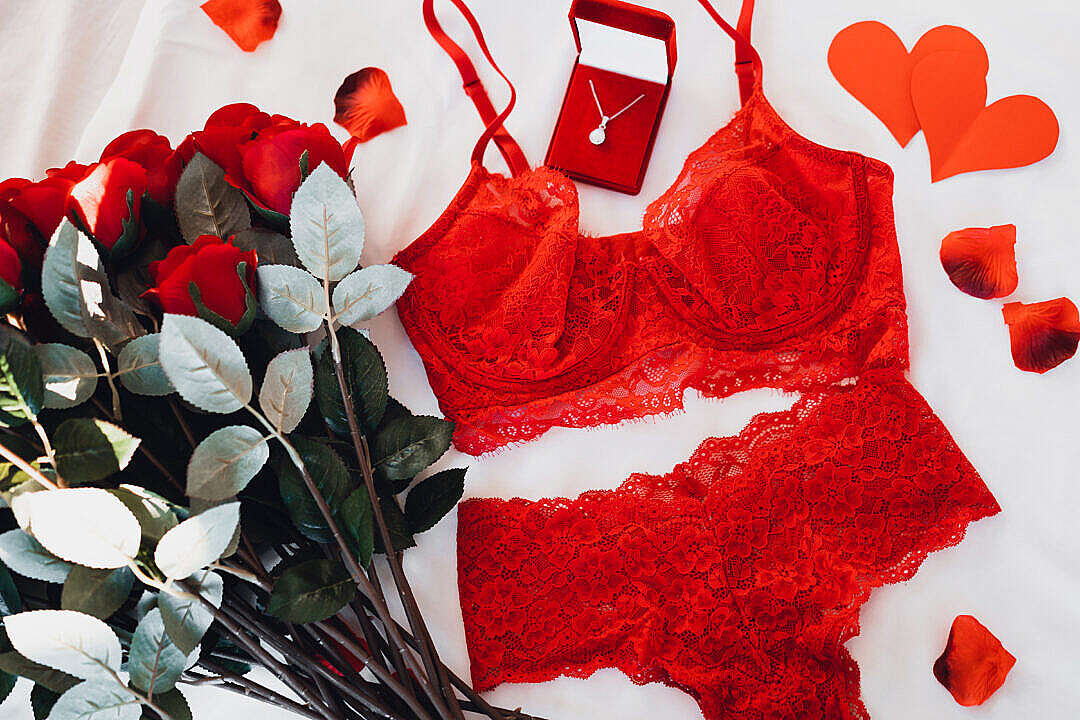 Red Sexy Lingerie with a Bouquet of Roses and a Necklace