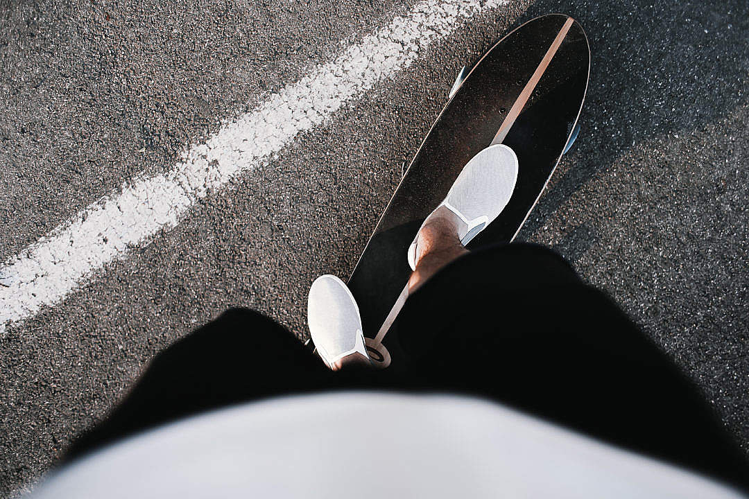 Riding a Longboard with Slip Ons