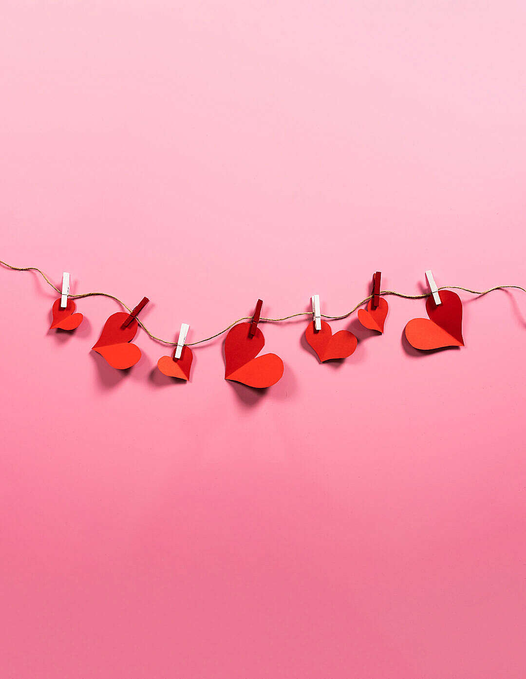 Download Romantic Love Paper Red Hearts Hanging on a String FREE Stock Photo