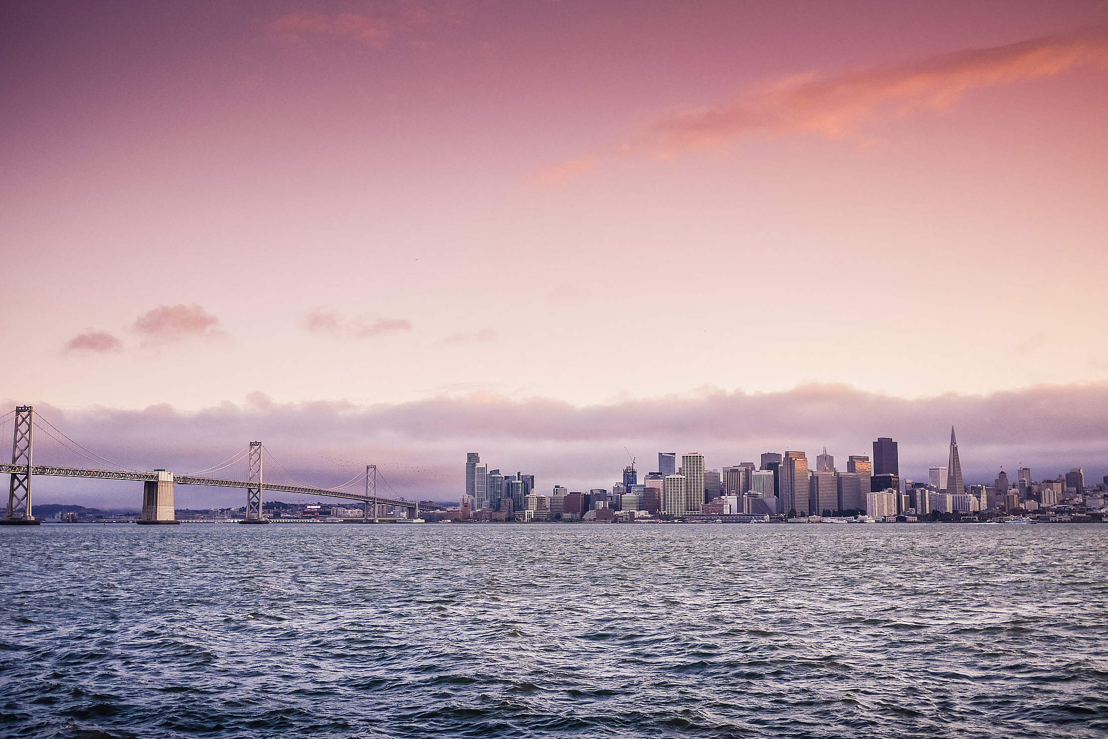 San Francisco Evening Skyline and Bay Bridge at Sunset Free Stock Photo