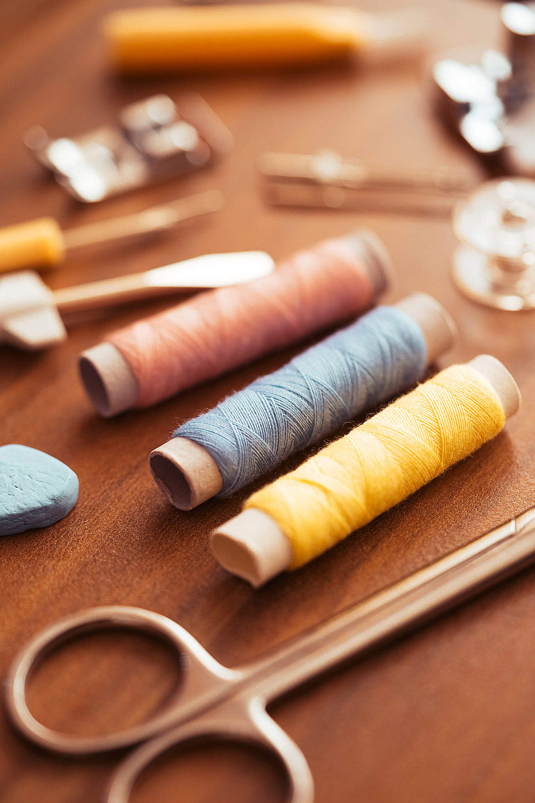 Download Sewing Kit on The Wooden Table FREE Stock Photo