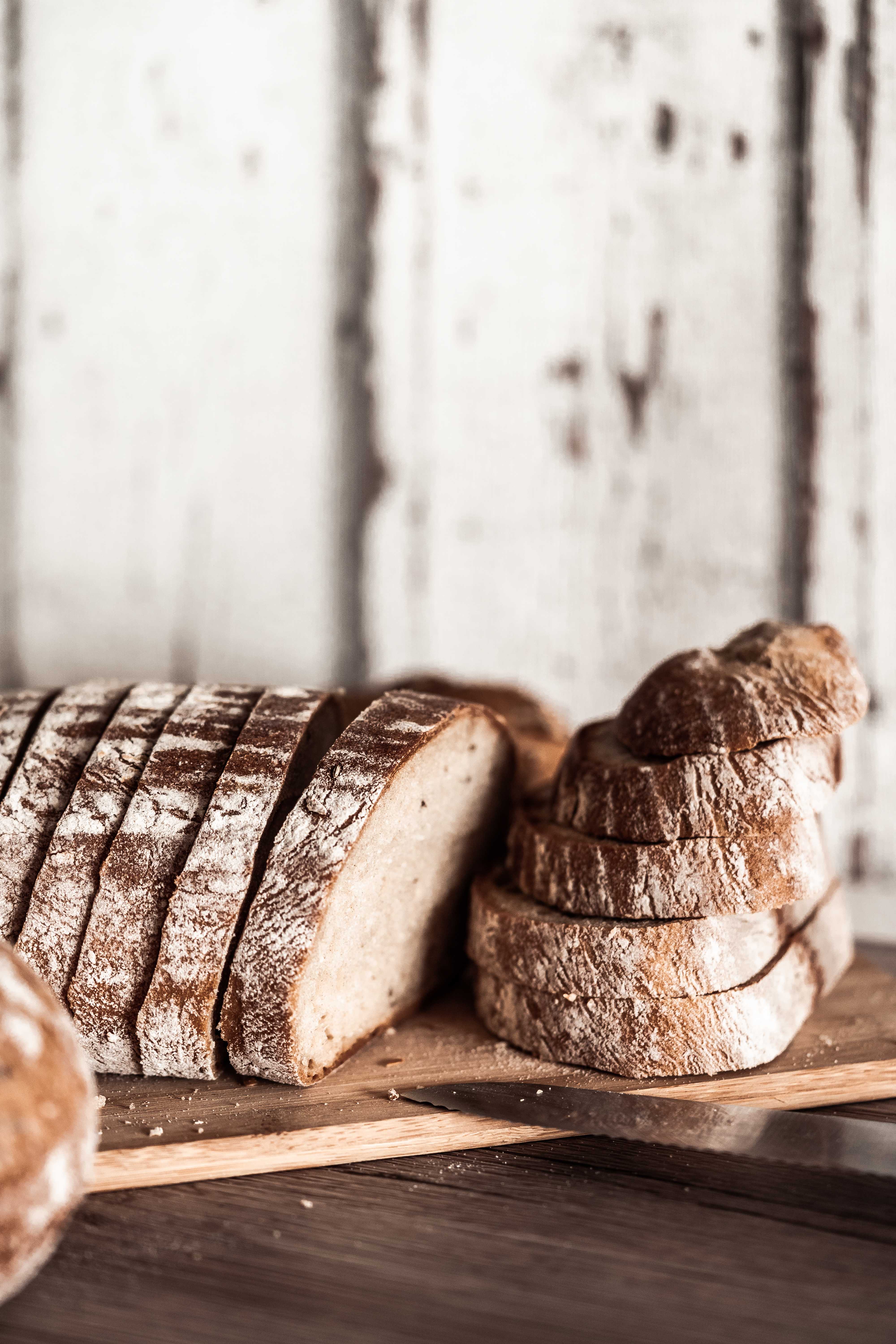 Sourdough bread slicing Stock Photo by grafvision