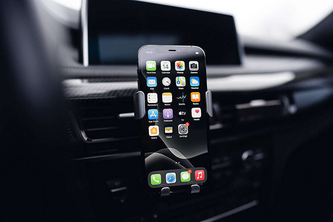 Download Smartphone in a Car Holder FREE Stock Photo