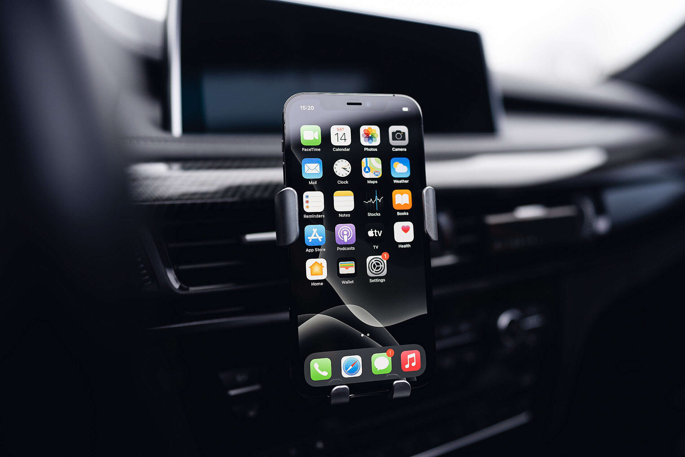 Smartphone in a Car Holder Free Stock Photo