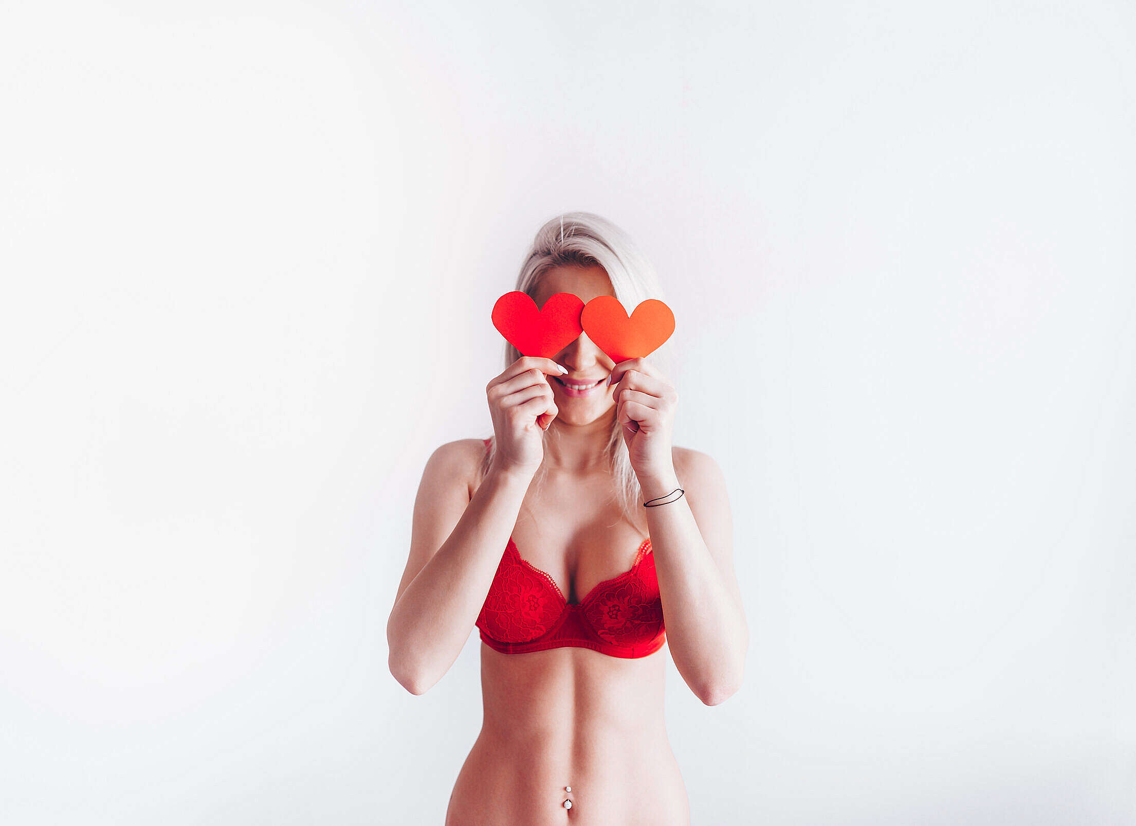 Smiling Woman with Lovely Valentine’s Day Hearts Free Stock Photo