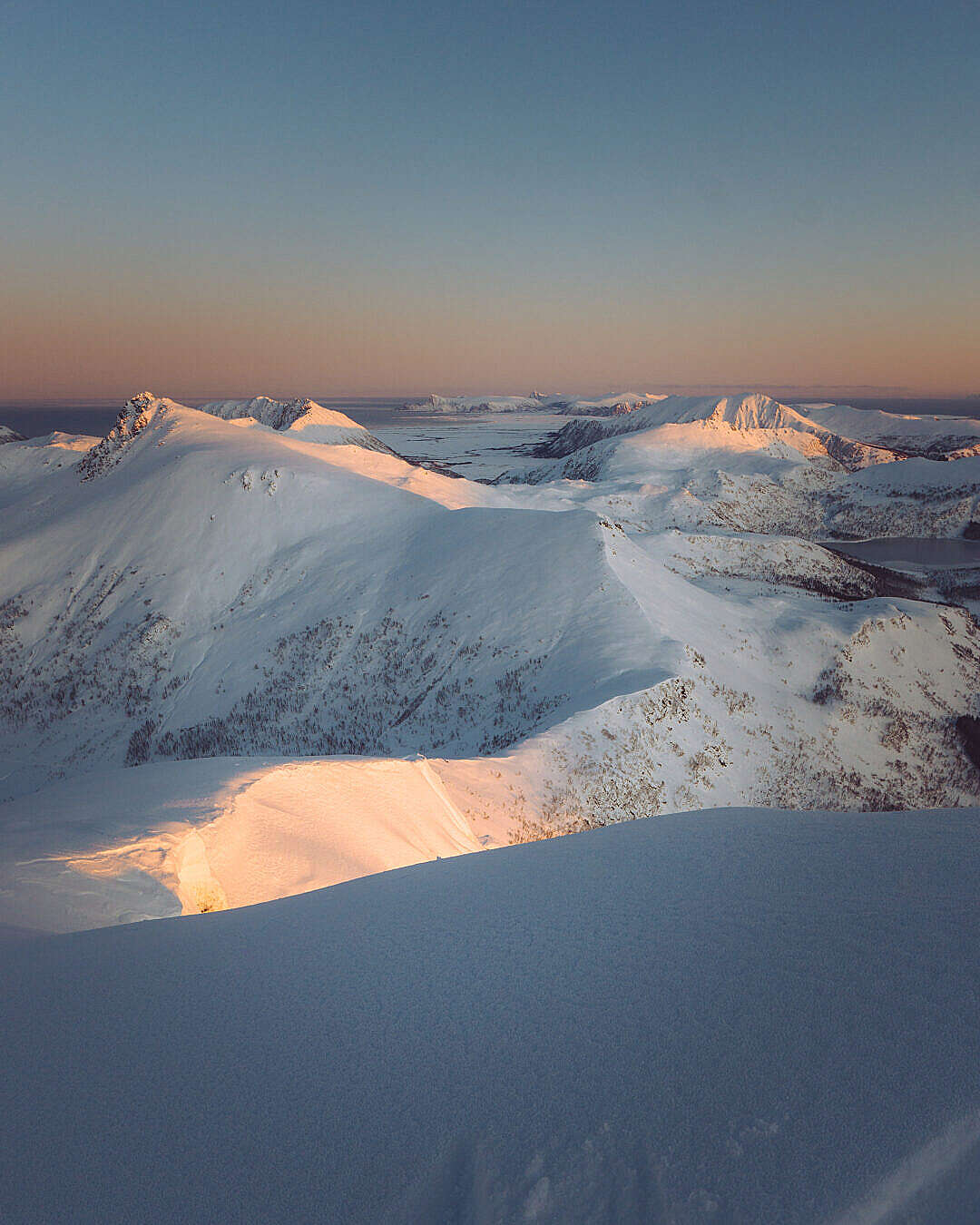 Download Snowy Mountain Peaks in Sunrise Light FREE Stock Photo
