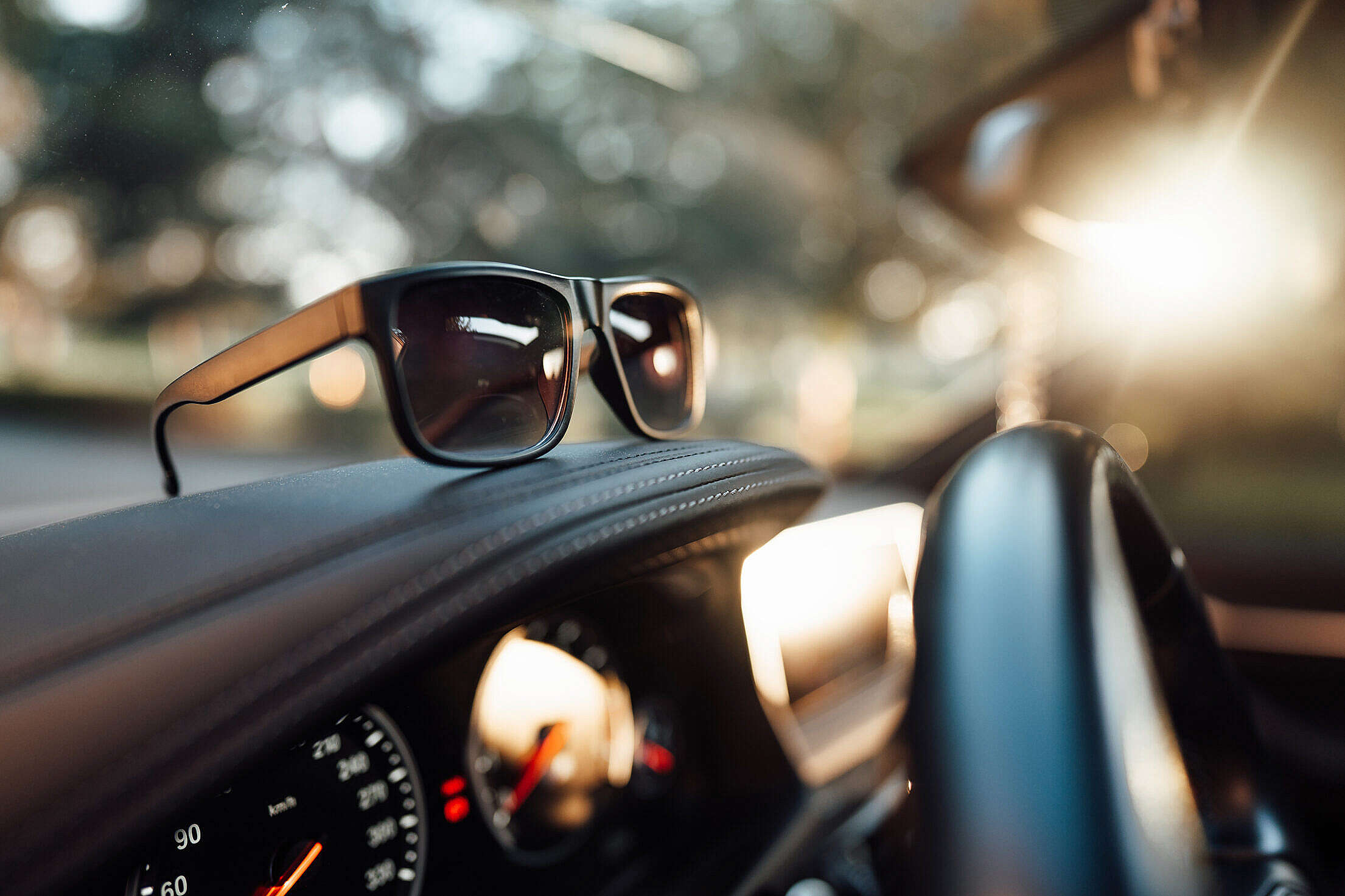 Sunglasses on The Dashboard Free Stock Photo