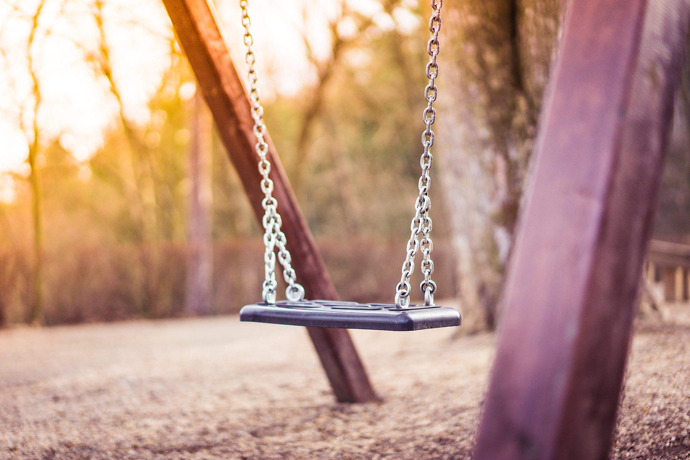 Swing For Kids in City Park Playground #2 Free Stock Photo