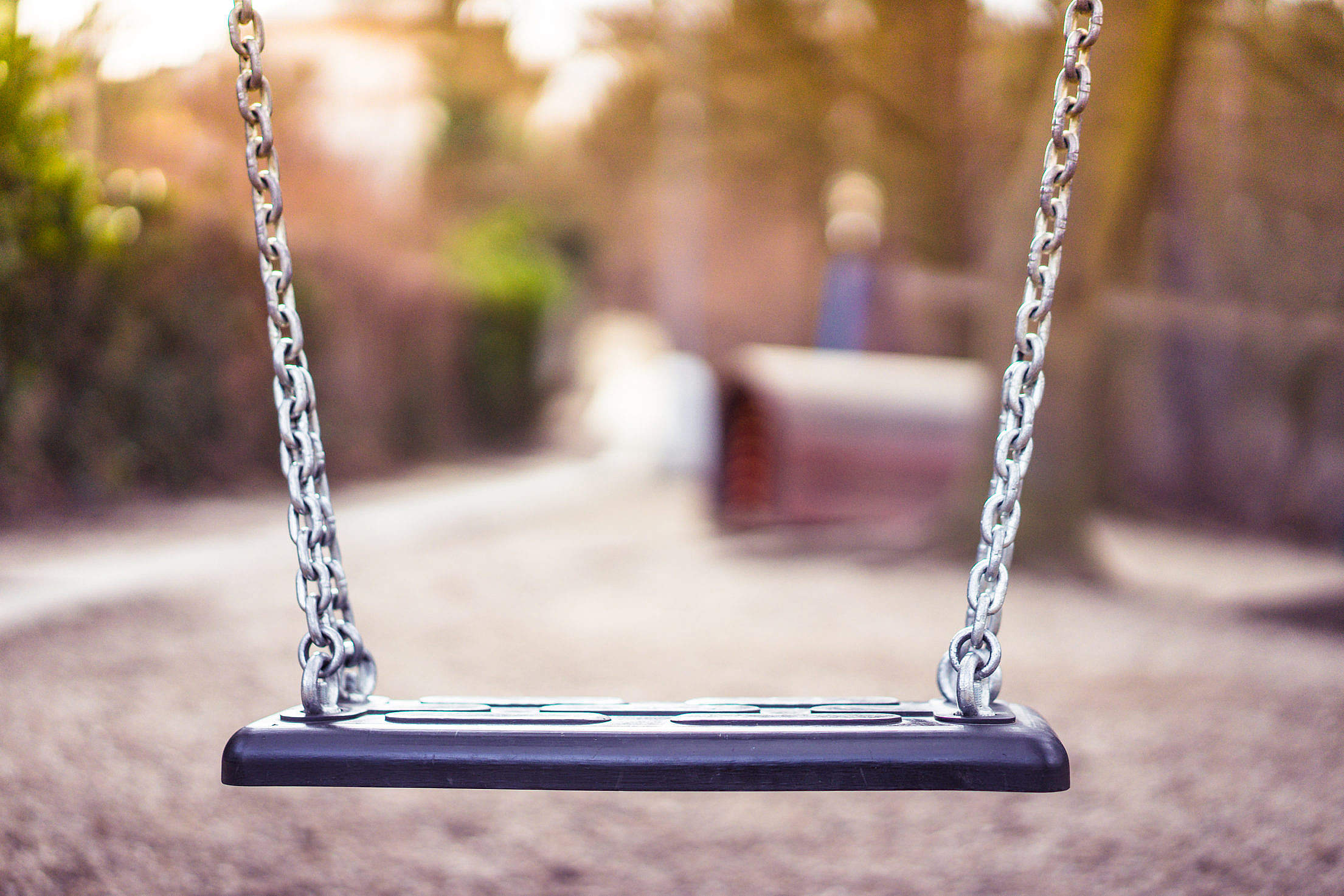 Swing For Kids in City Park Playground Free Stock Photo