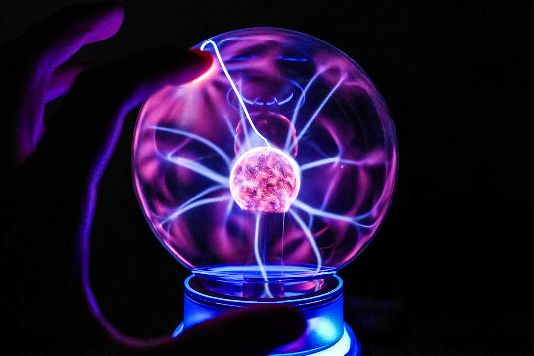 Download Touching The Plasma Ball Lamp FREE Stock Photo