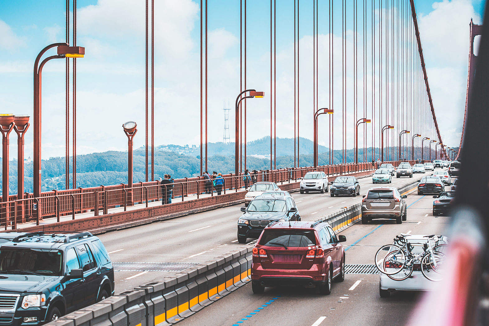 Traffic: a Lot of Cars Driving Across The Golden Gate Bridge Free Stock