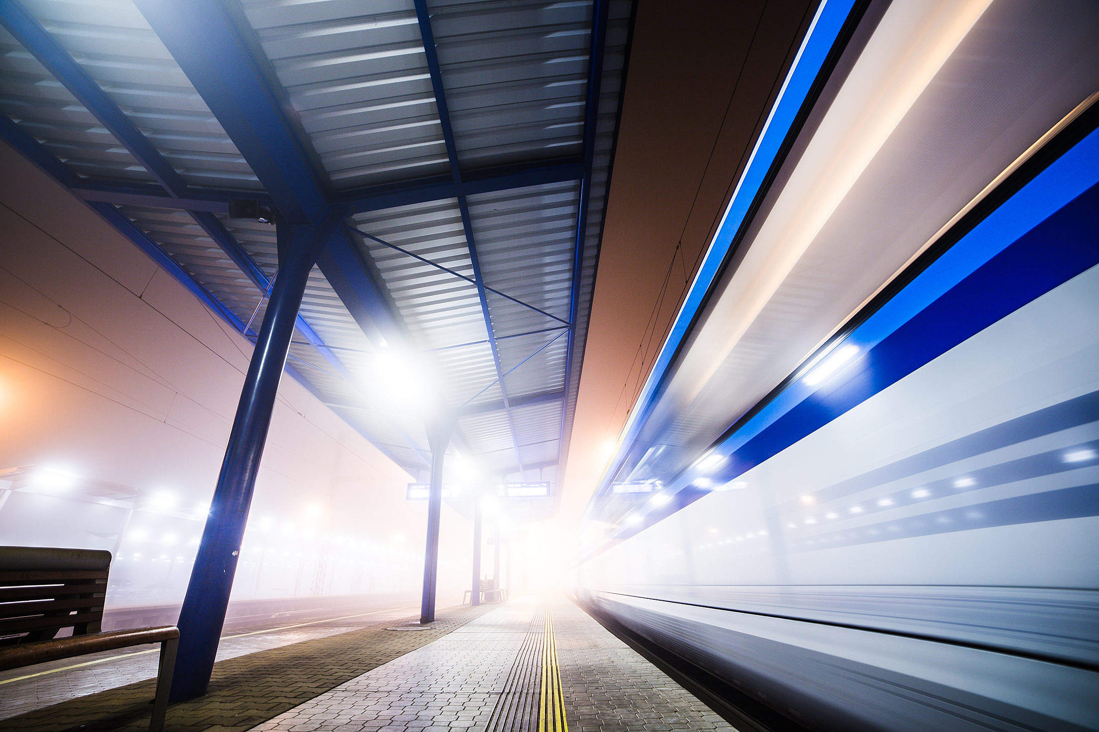 Train Leaving The Railway Station At Night Free Stock Photo