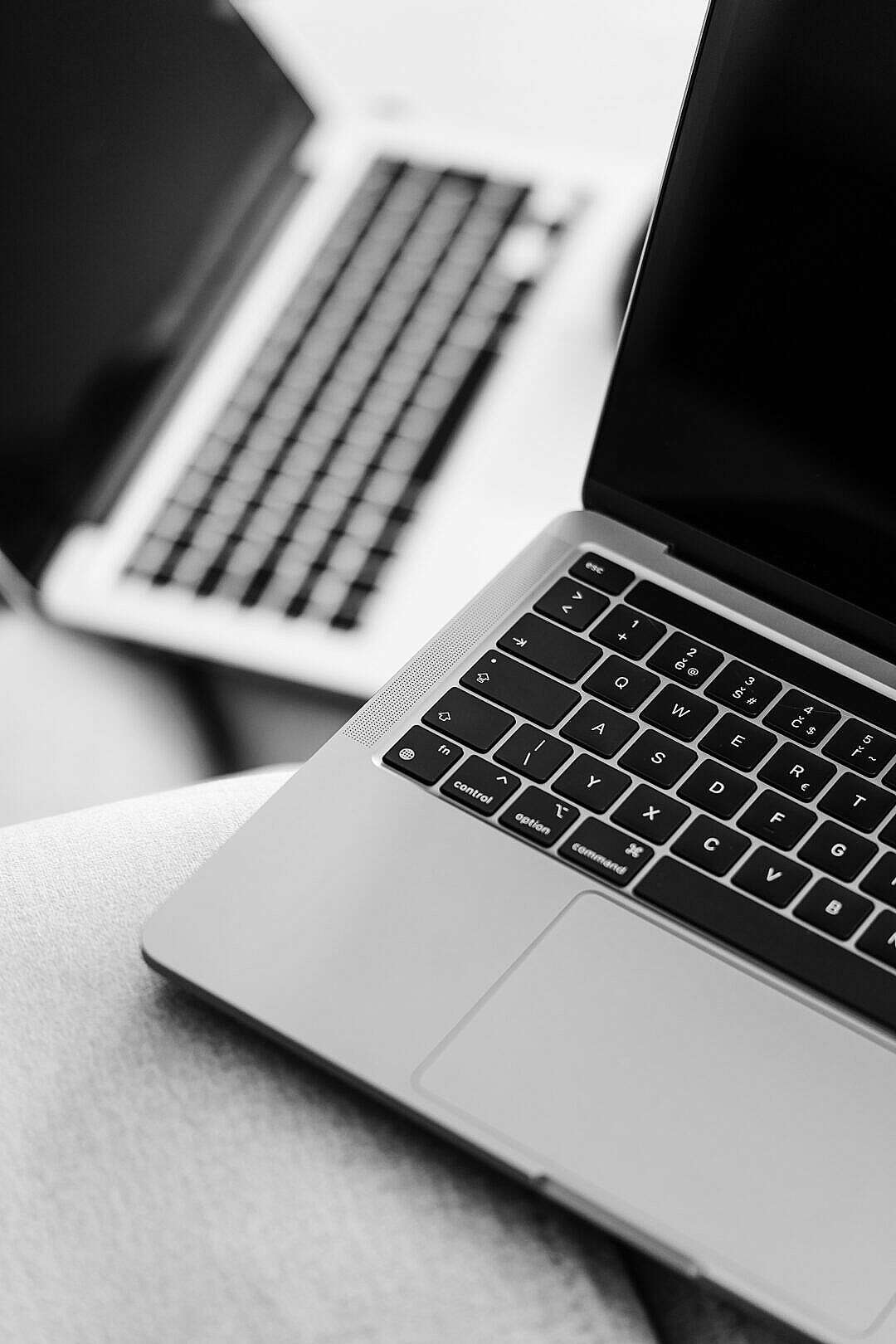 Download Two MacBook Pro Laptops Black and White FREE Stock Photo