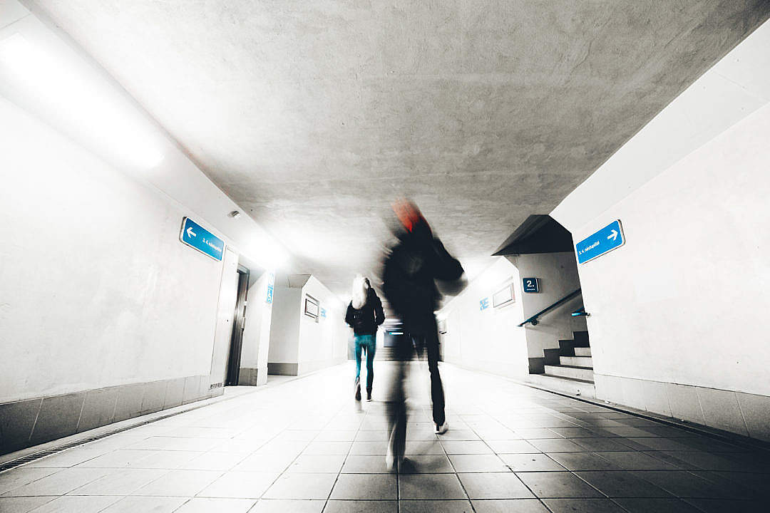 Two People Go Through The Underpass