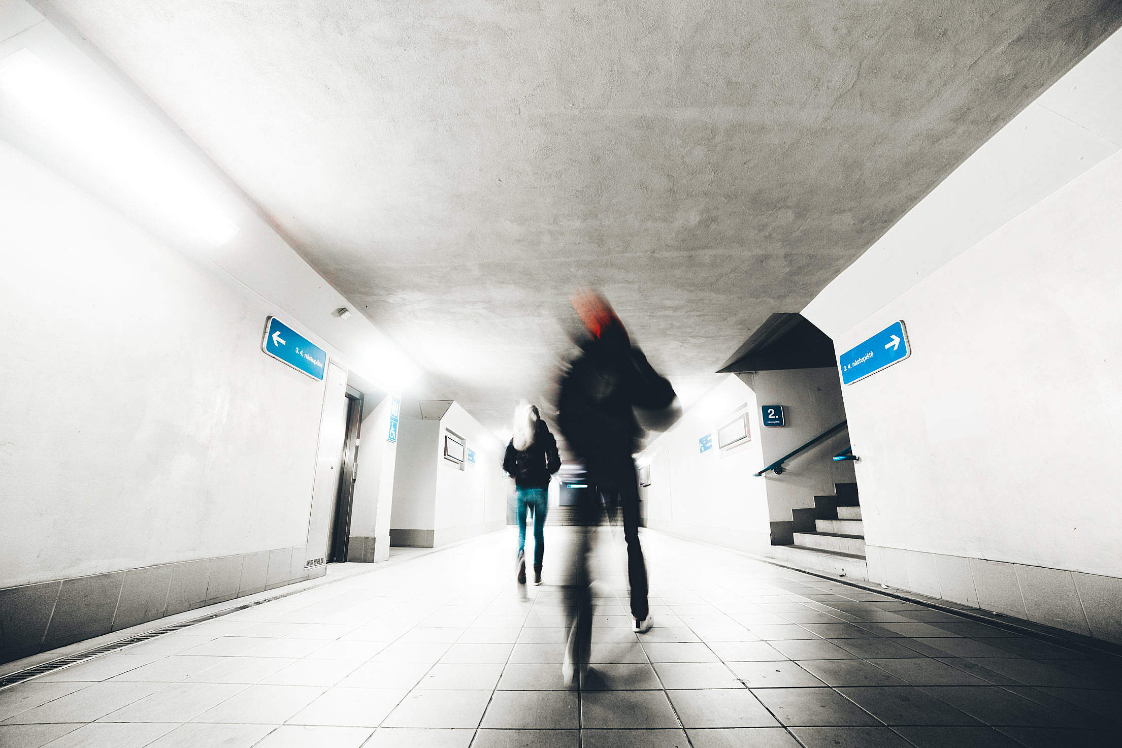Two People Go Through The Underpass Free Stock Photo