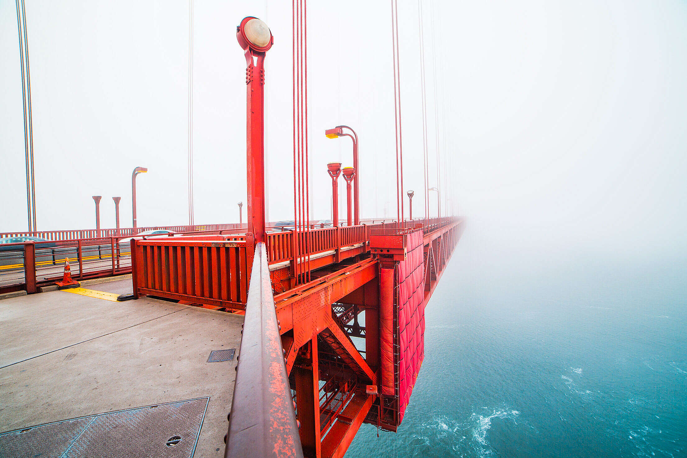 Walking on The San Francisco Golden Gate Bridge Covered in Fog Free Stock Photo