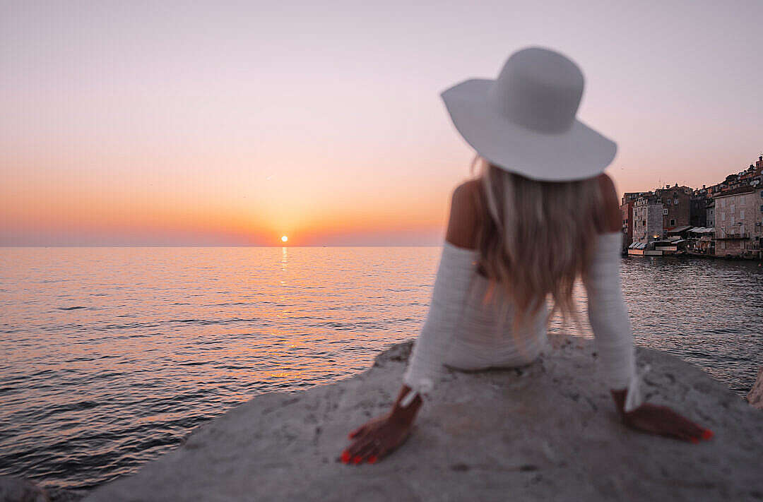 Well Dressed Woman Watching Beautiful Sunset Above the Sea